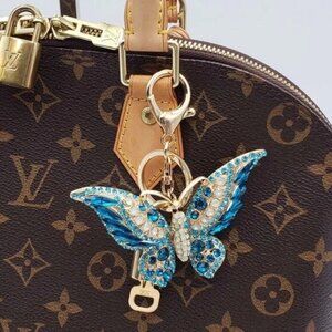 Authentic Louis Vuitton Lock & Key with unbranded Butterfly Bagcharm, Keycharm
